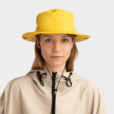 Yellow Tilley Rain Hat front view on model