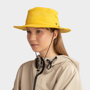 Yellow Tilley Rain Hat side view on model