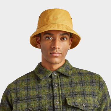 Vintage Gold The Iconic T1 Bucket Hat front view on model