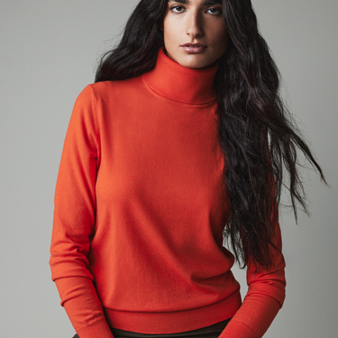 Orange Women's Stretch Merino Turtleneck front view on model 2